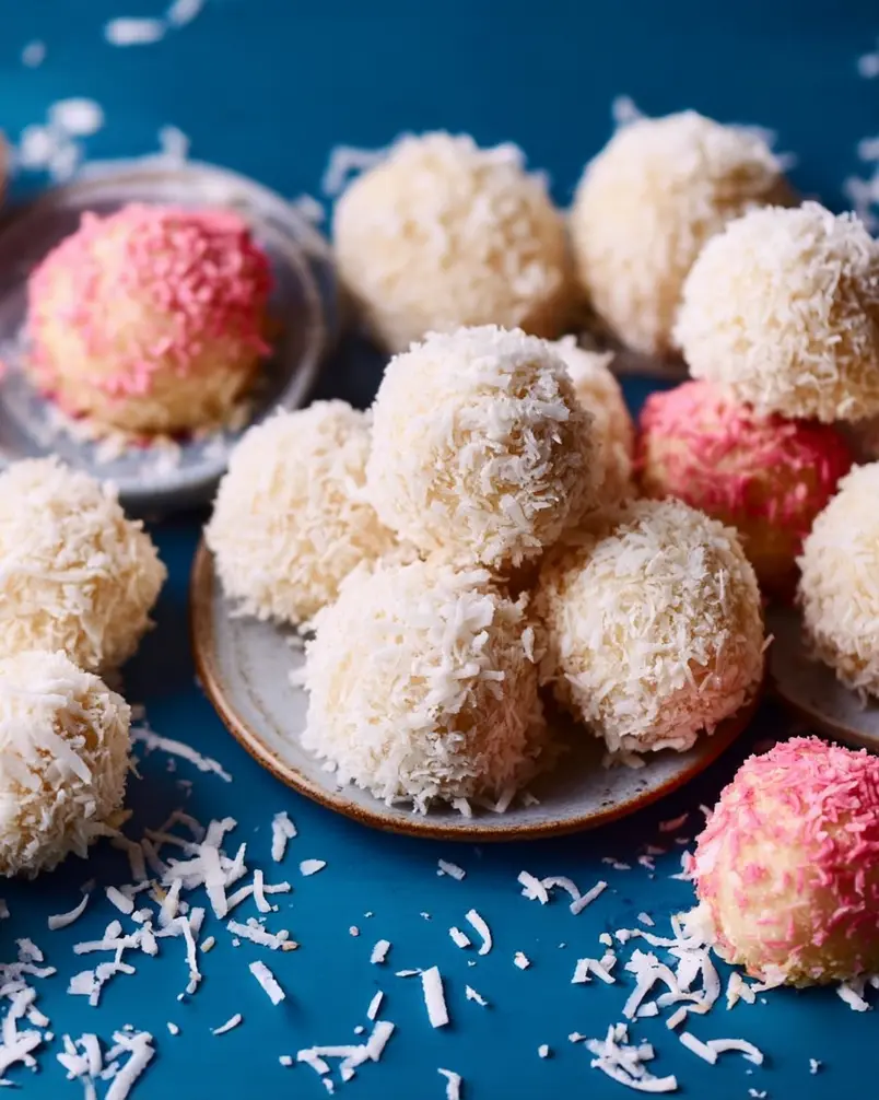 Coconut Cake Snowballs 3 Dough balls arranged on a baking sheet ready for the oven